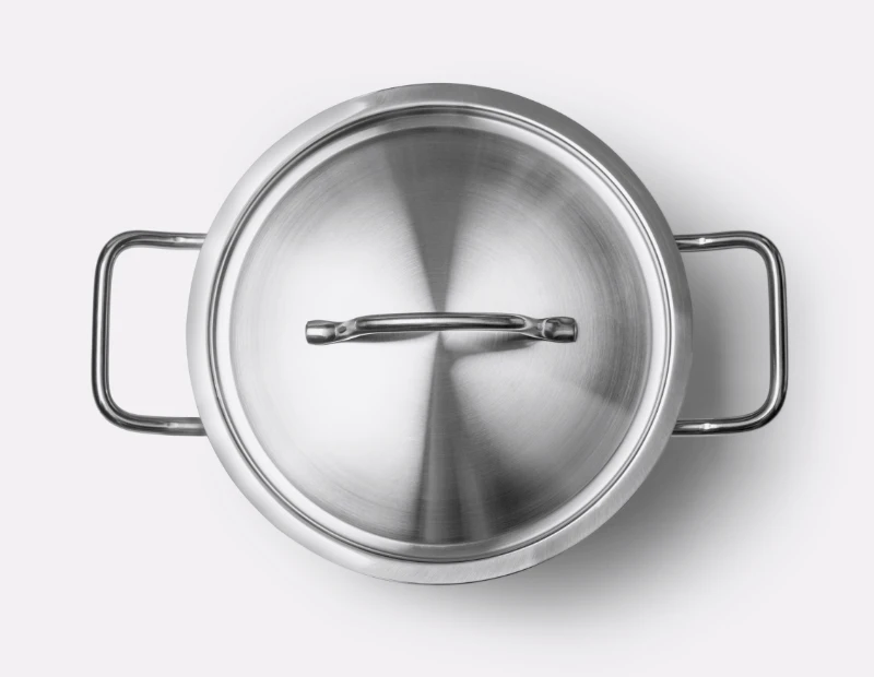 A shiny clean pot with a lid on it
