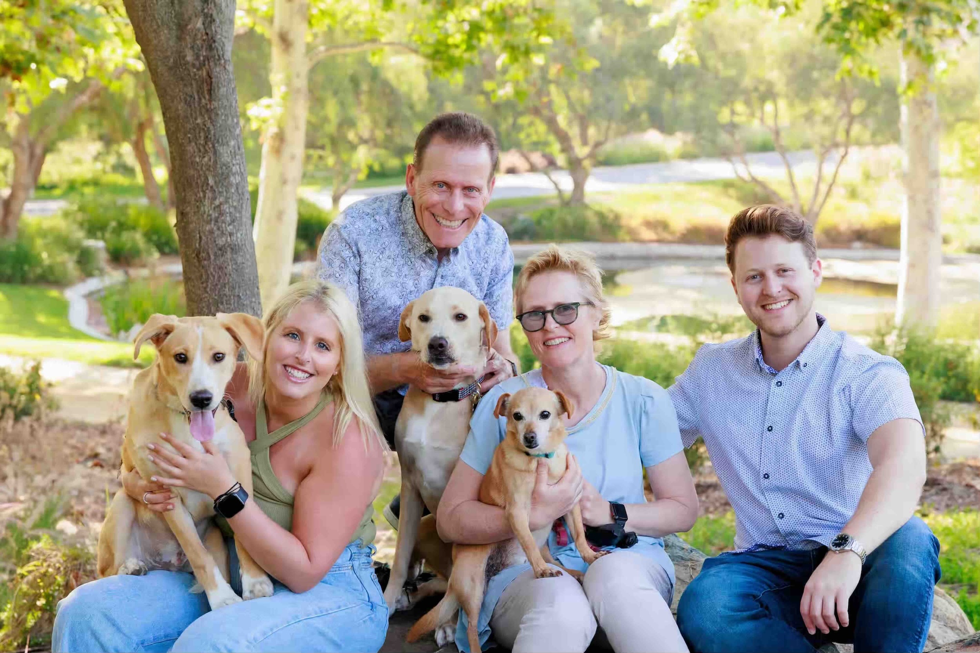 The family behind Hyginix LLC, posing together outdoors