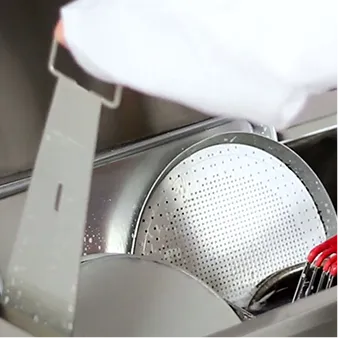 Removing clean dishes from the FOG Tank.